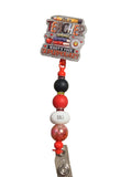 Teacher-themed badge holder with colorful beads on a beige surface