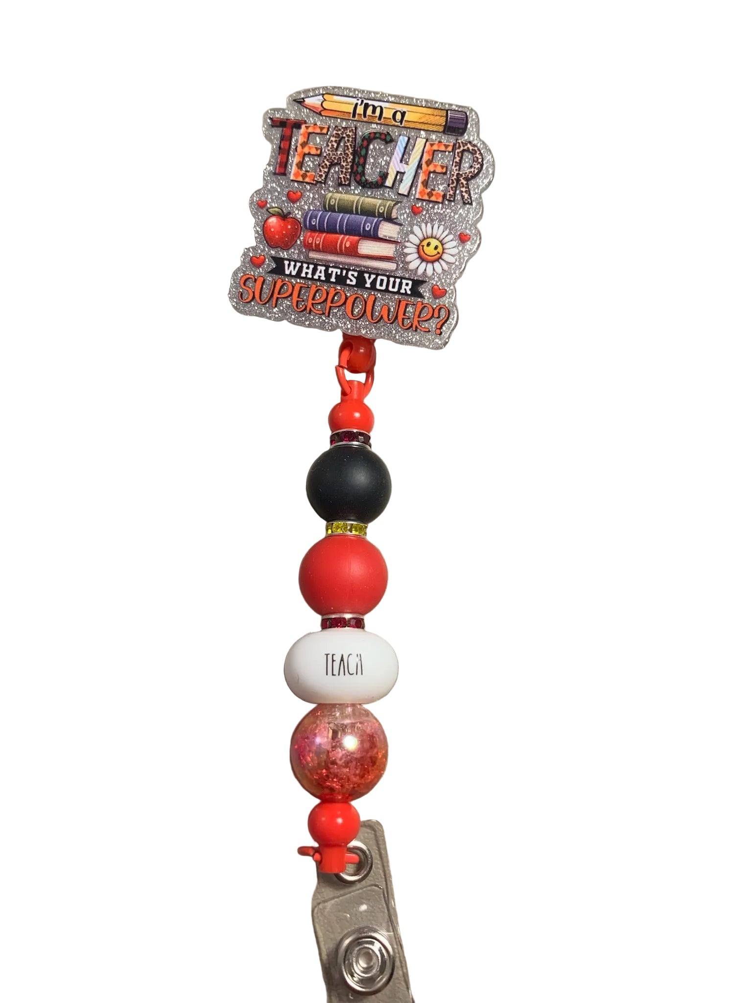 Teacher-themed badge holder with colorful beads on a beige surface