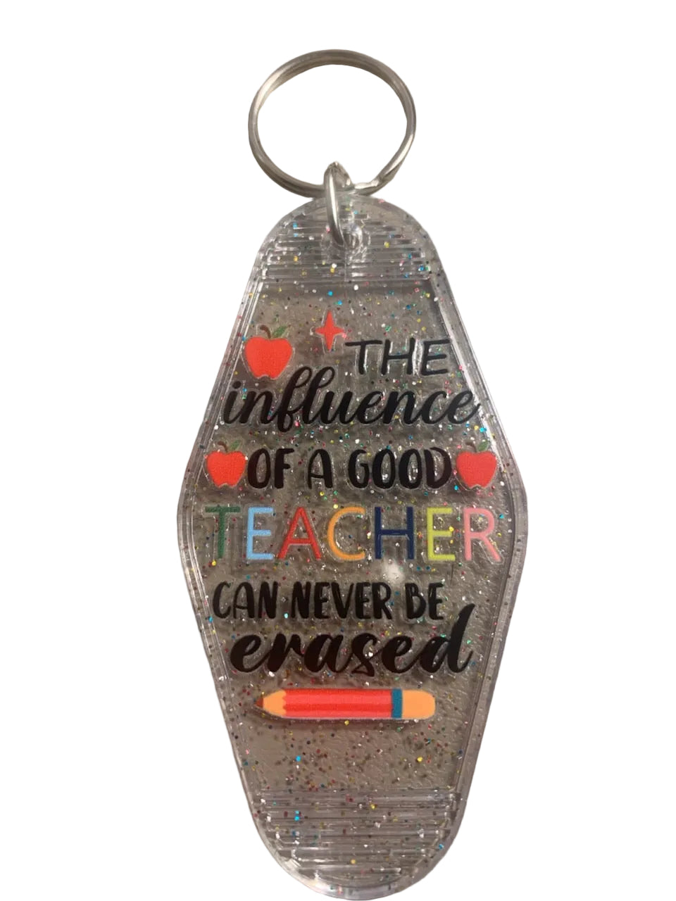 Clear keychain with motivational quote on a gray surface